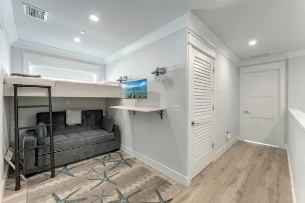 a view of hallway with wooden floor