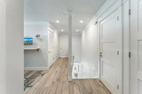 a view of a hallway with washer and dryer