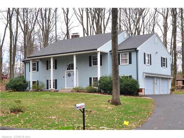 58 Highwood Road Farmington, CT 06032 - Photo 1 of 1 a front view of a house with a yard