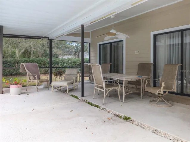 a kitchen with a sink window and cabinets