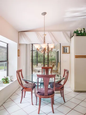 a view of a livingroom with workspace and a couch