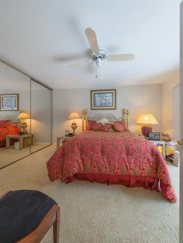 a spacious bedroom with a bed and window