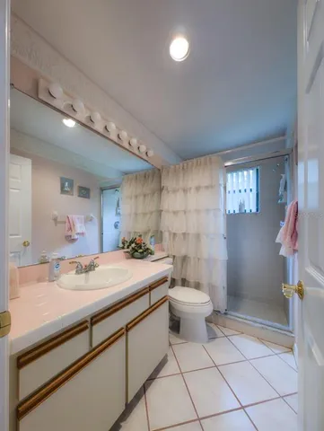 a bathroom with a sink double vanity and a mirror