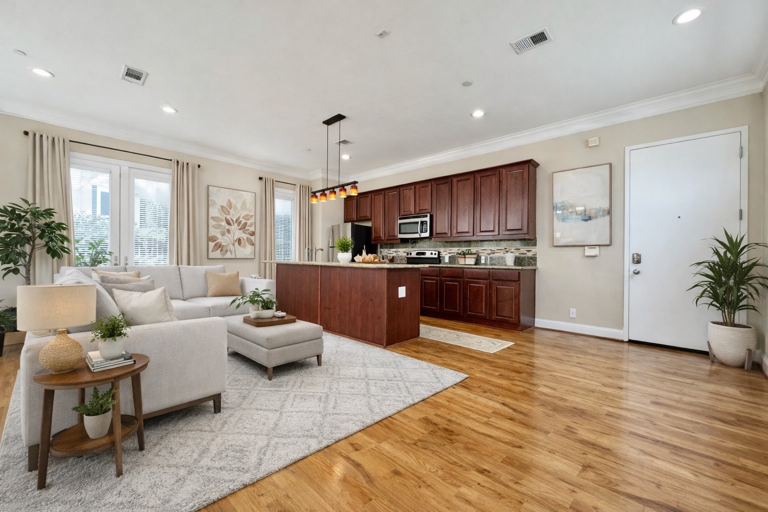 314 West Bell Street, Unit 201 Houston, TX 77019 - Photo 13 of 32 a living room with furniture kitchen and a wooden floor