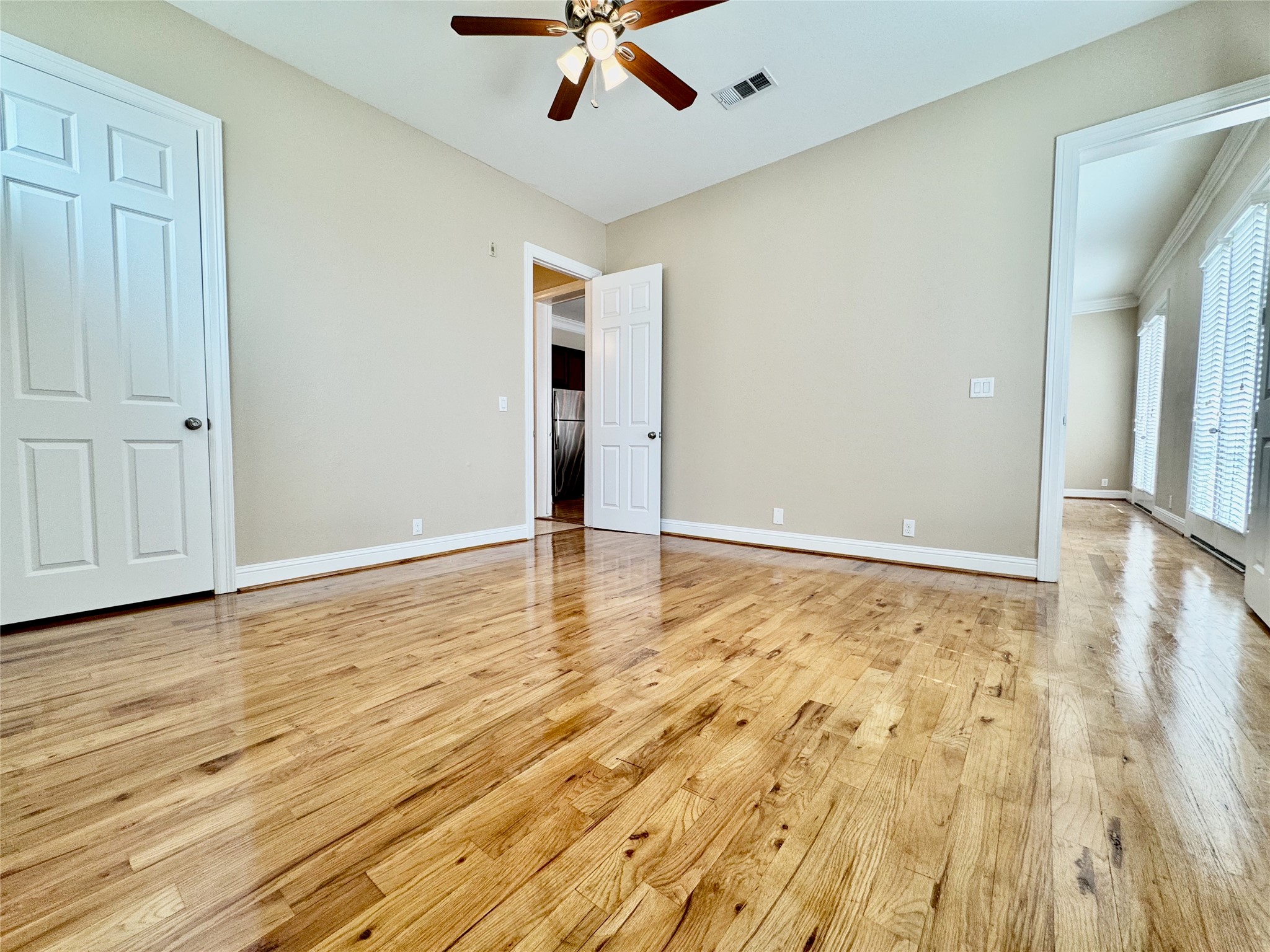 314 West Bell Street, Unit 201 Houston, TX 77019 - Photo 26 of 32 a view of room with wooden floor and white walls