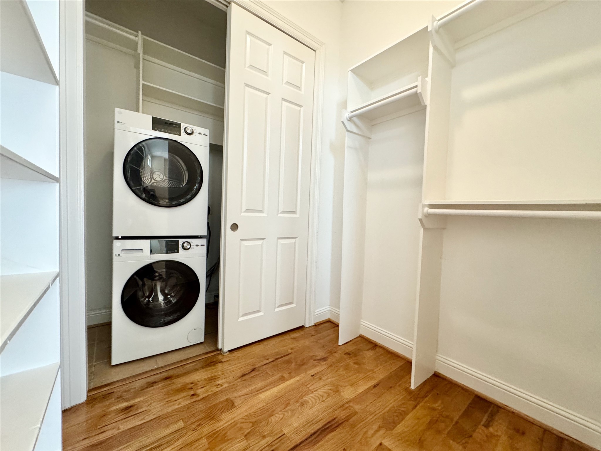 314 West Bell Street, Unit 201 Houston, TX 77019 - Photo 28 of 32 a view of a hallway with washer and dryer