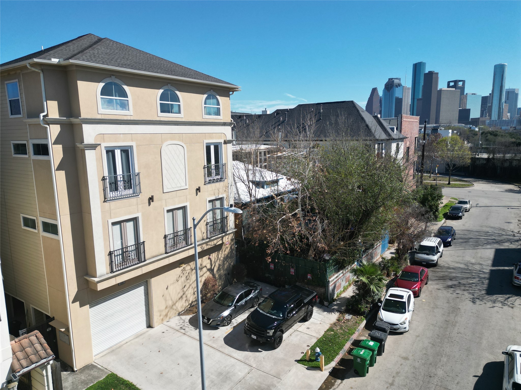 314 West Bell Street, Unit 201 Houston, TX 77019 - Photo 3 of 32 a front view of a house with parking