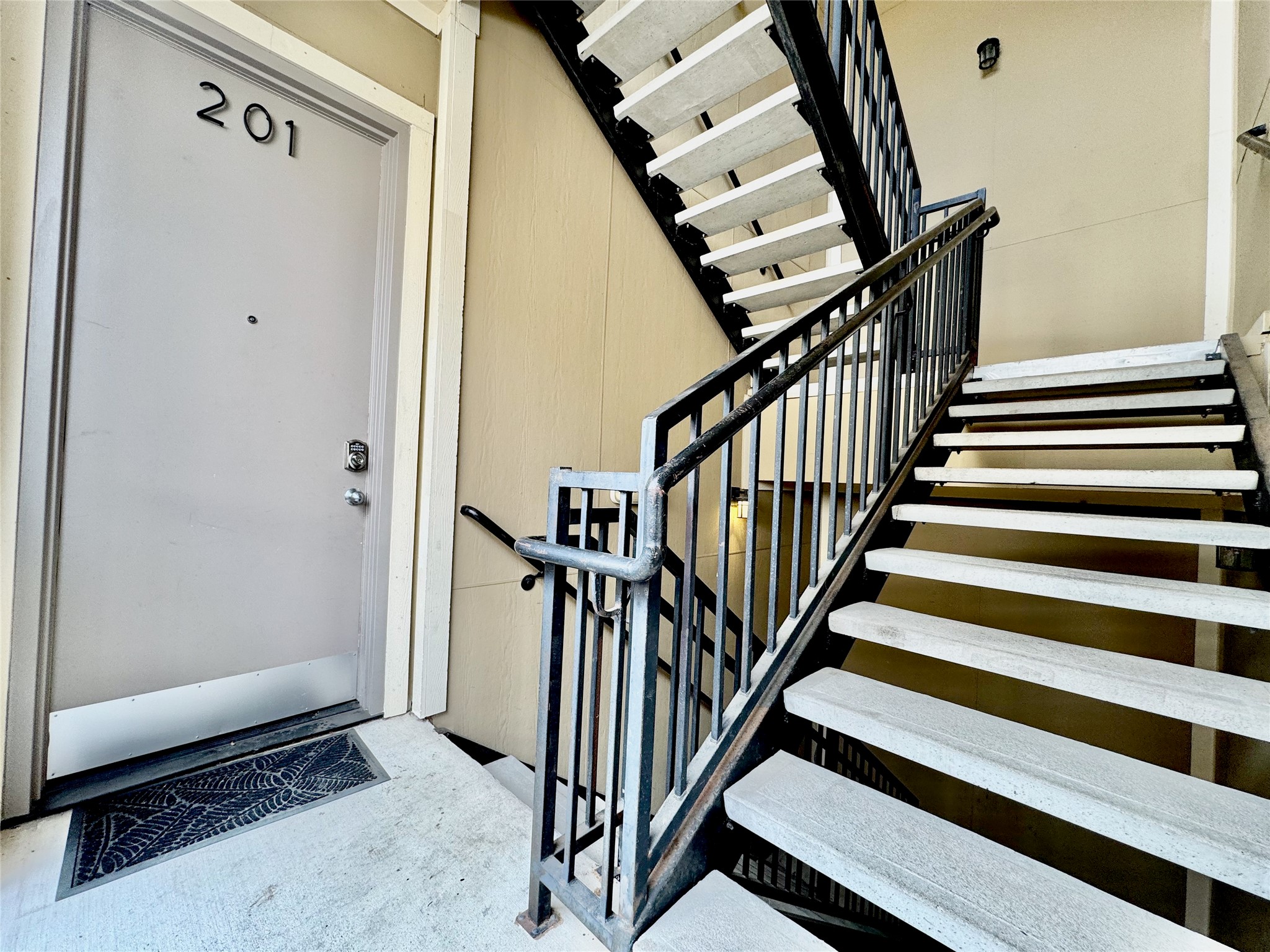 314 West Bell Street, Unit 201 Houston, TX 77019 - Photo 9 of 32 a view of a hallway with wooden floors and stairs