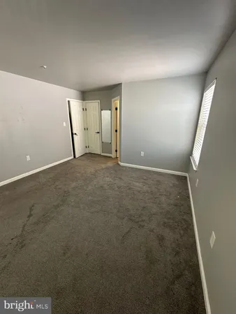 en empty room with windows