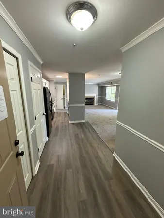 a view of a livingroom with wooden floor