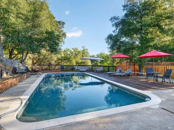 a view of a swimming pool with a patio