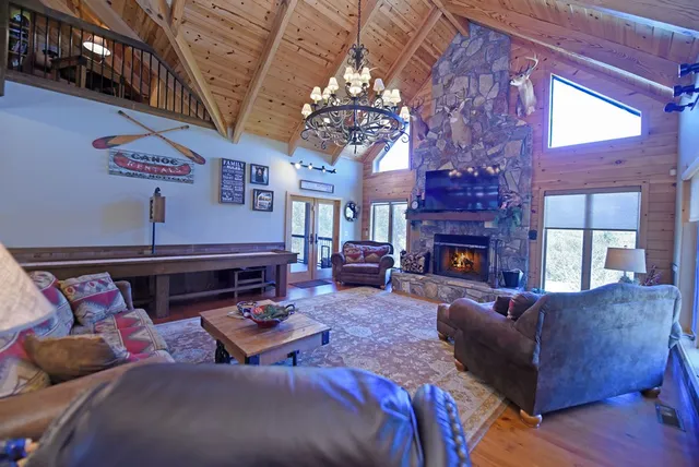 a kitchen with stainless steel appliances granite countertop wooden cabinets and a sink