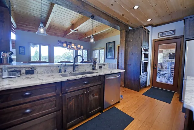 a spacious bathroom with a bathtub sink and mirror