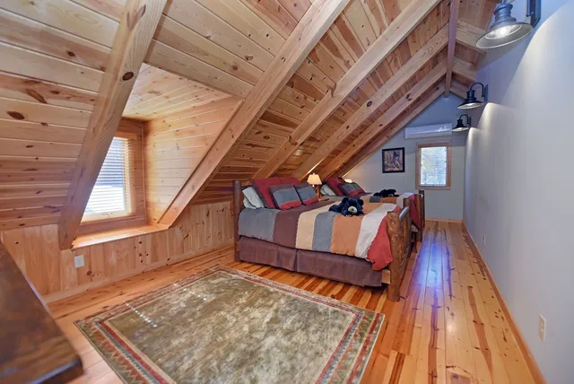 a view of a house with a patio and a yard