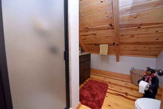 a view of a patio with table and chairs under an umbrella