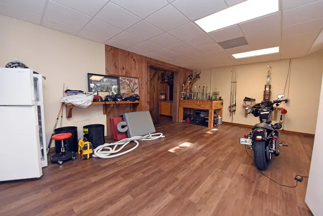 a kitchen with stainless steel appliances granite countertop a sink and a refrigerator