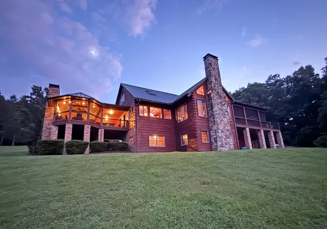 a living room with lots of furniture and a chandelier