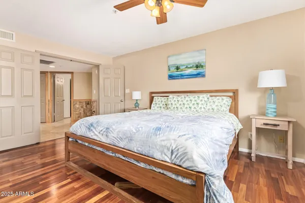 a bedroom with a bed and a lamp