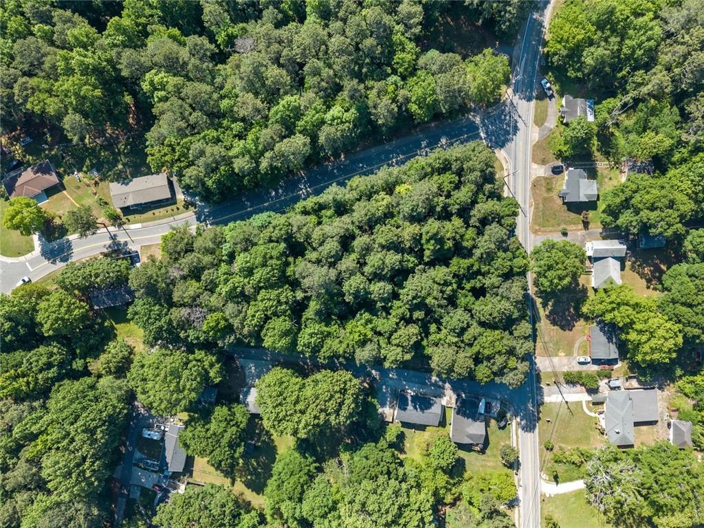 5305 Sycamore Road Sugar Hill, GA 30518 - Photo 4 of 22 an aerial view of residential house with outdoor space and trees all around