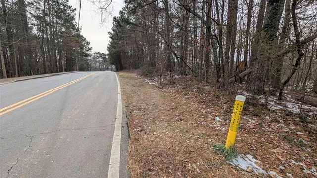 a view of a yard with basketball court
