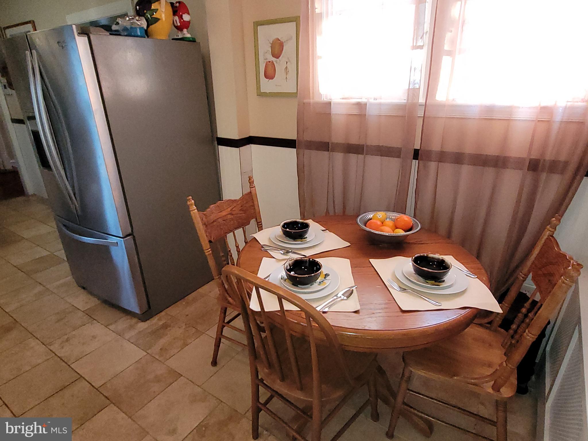 3805 State Road Drexel Hill, PA 19026 - Photo 8 of 52 a view of a dining table and chairs in the kitchen