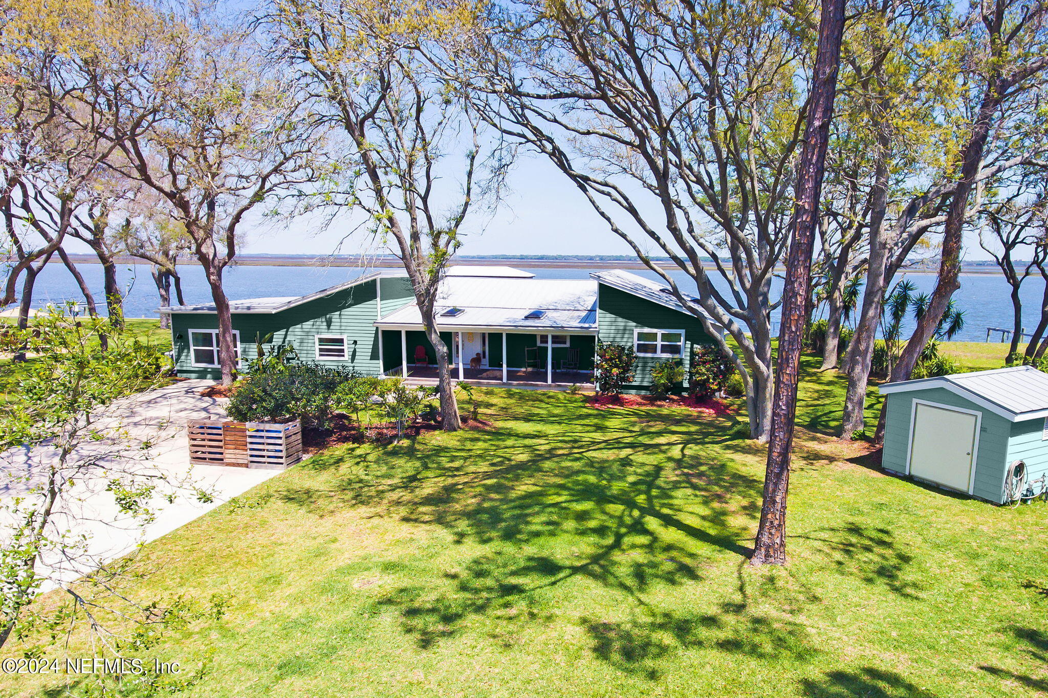 a front view of a house with a yard table and chairs