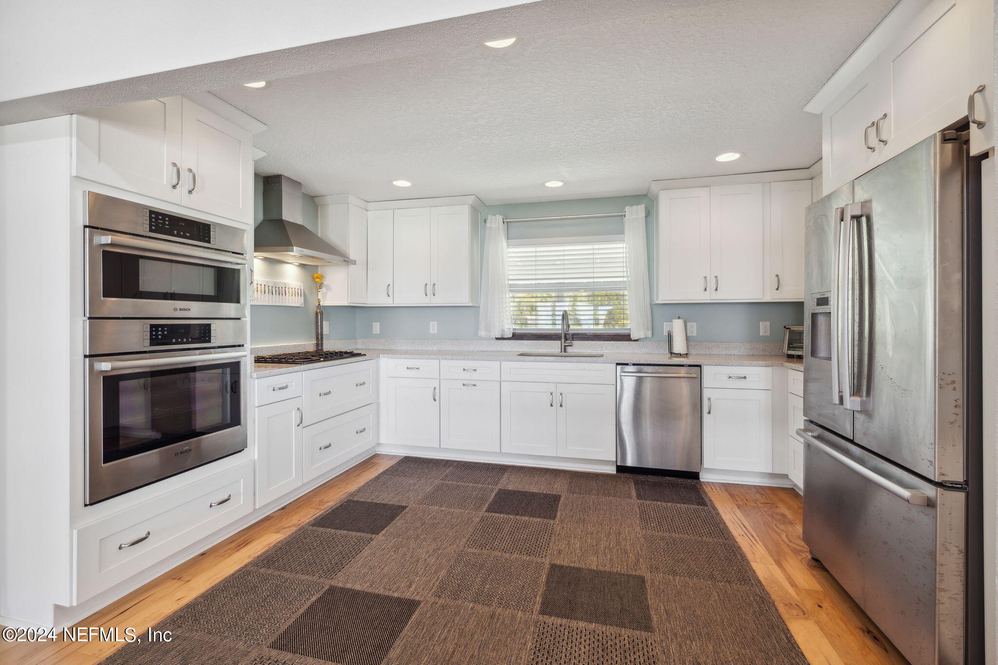 16045 Shellcracker Road Jacksonville, FL 32226 - Photo 11 of 40 a kitchen with a white stainless steel appliances and white cabinets