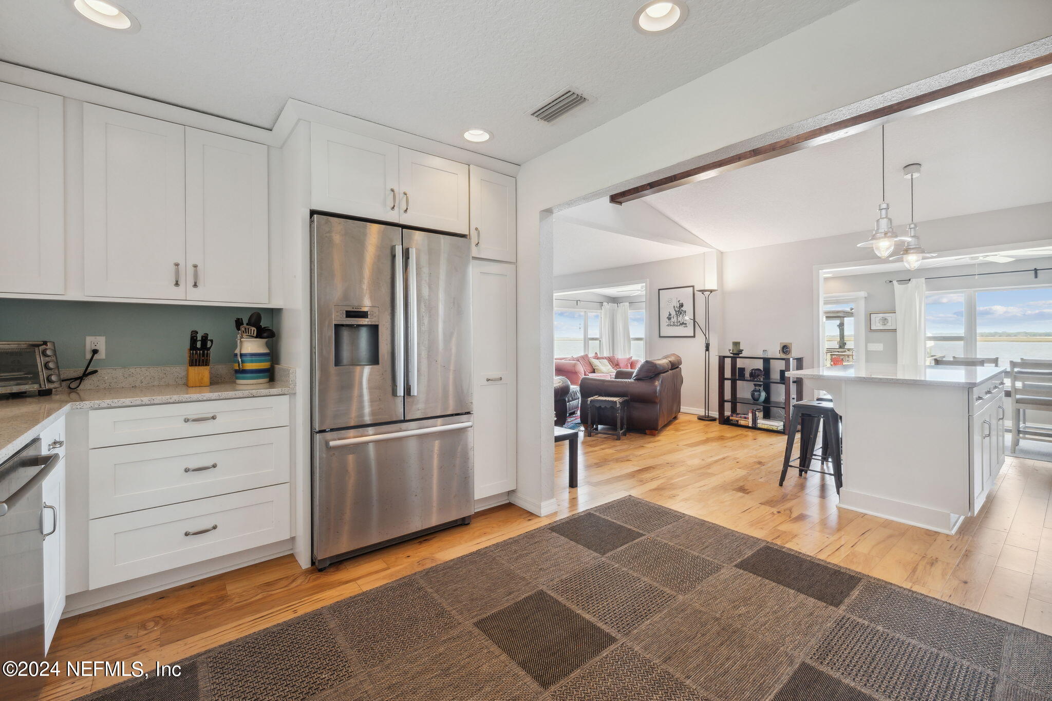 16045 Shellcracker Road Jacksonville, FL 32226 - Photo 13 of 40 a kitchen with stainless steel appliances kitchen island granite countertop a refrigerator and cabinets