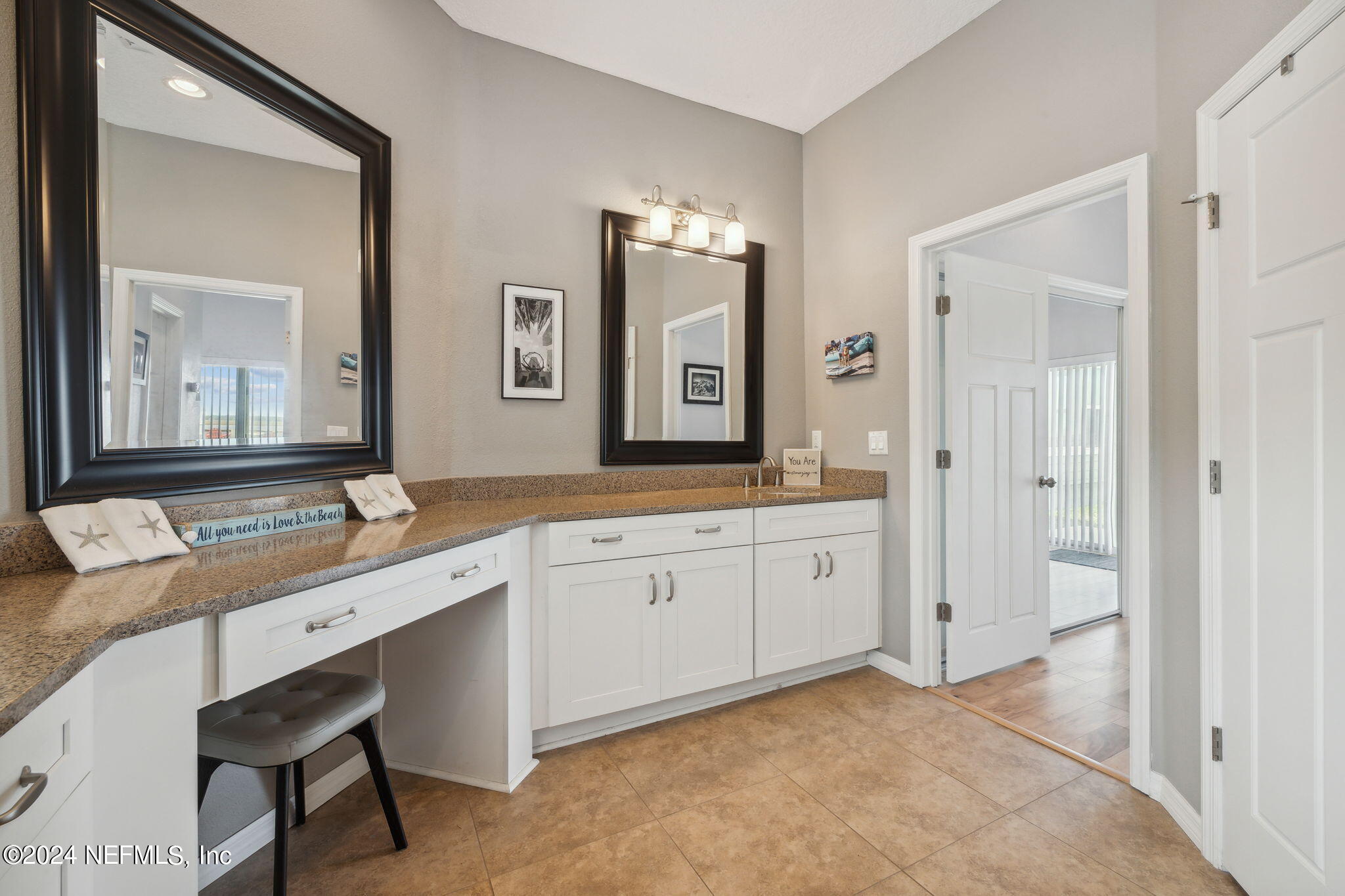 16045 Shellcracker Road Jacksonville, FL 32226 - Photo 18 of 40 a spacious bathroom with a granite countertop sink and a mirror