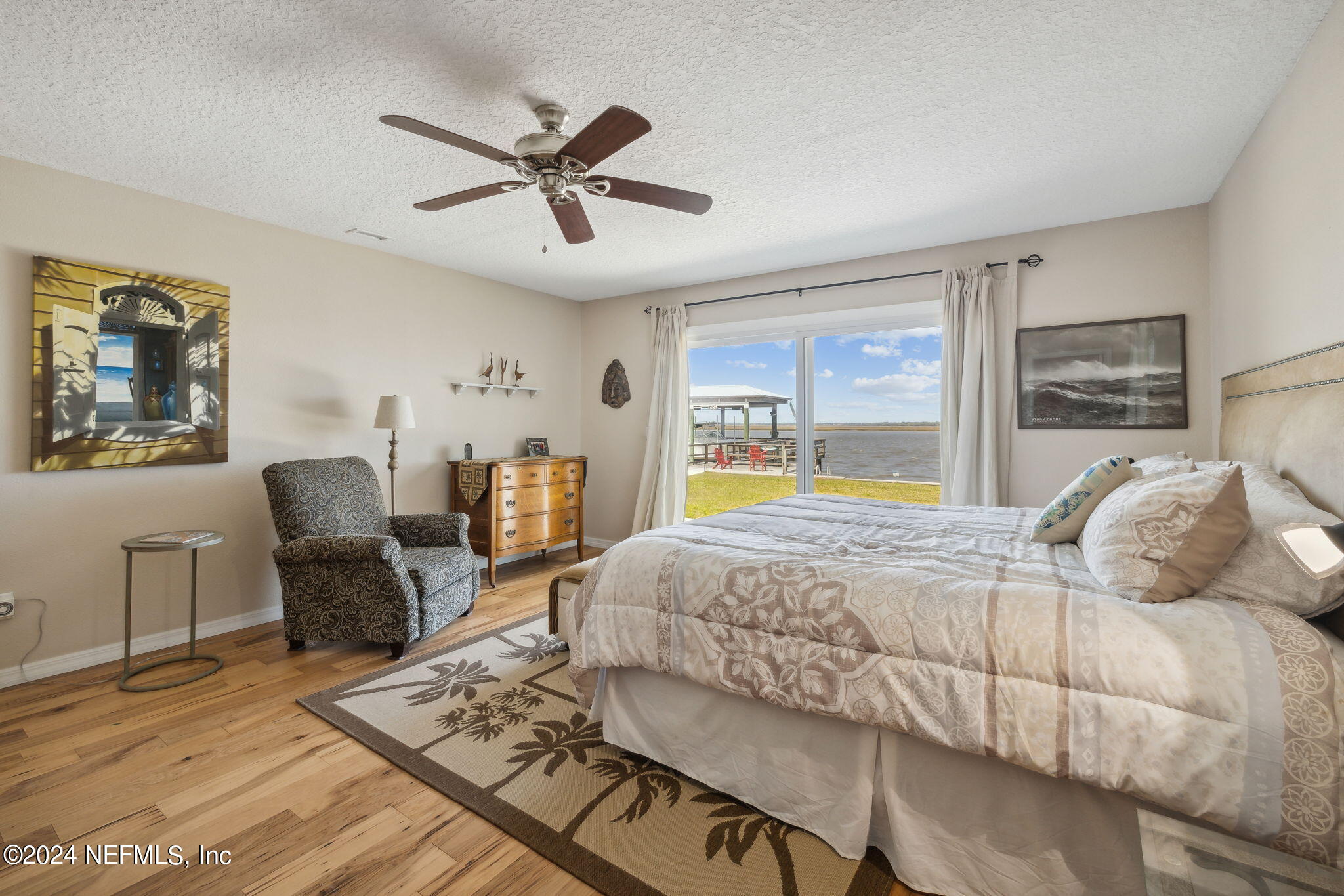 16045 Shellcracker Road Jacksonville, FL 32226 - Photo 22 of 40 a bedroom with a bed a couch and dresser