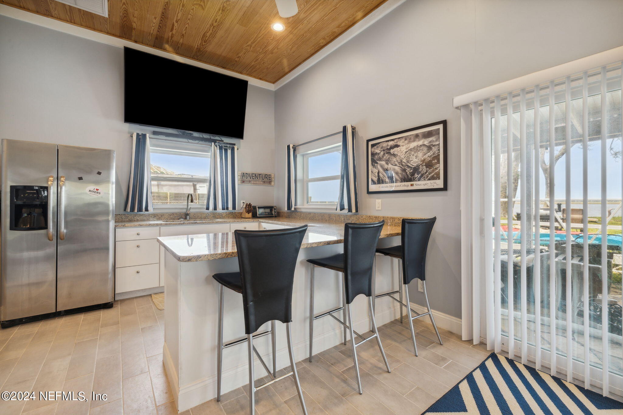 16045 Shellcracker Road Jacksonville, FL 32226 - Photo 30 of 40 a view of a dining room with furniture window and wooden floor