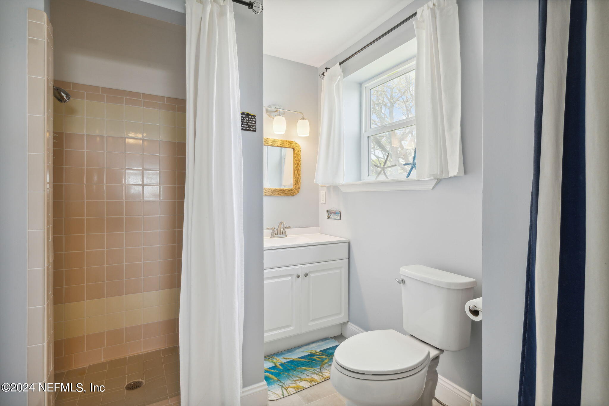 16045 Shellcracker Road Jacksonville, FL 32226 - Photo 32 of 40 a bathroom with a toilet a sink and a shower