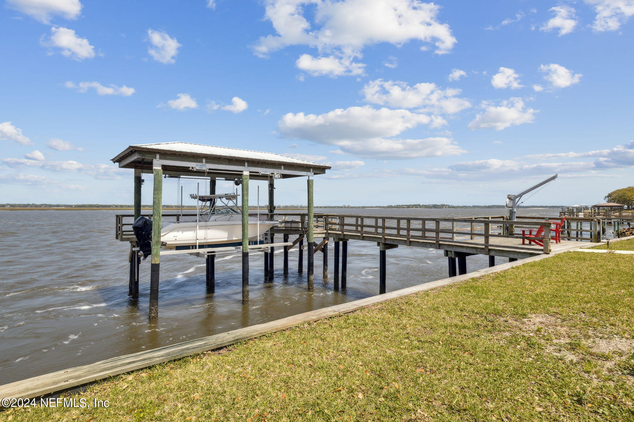 16045 Shellcracker Road Jacksonville, FL 32226 - Photo 34 of 40 a view of a swimming pool with table and chairs