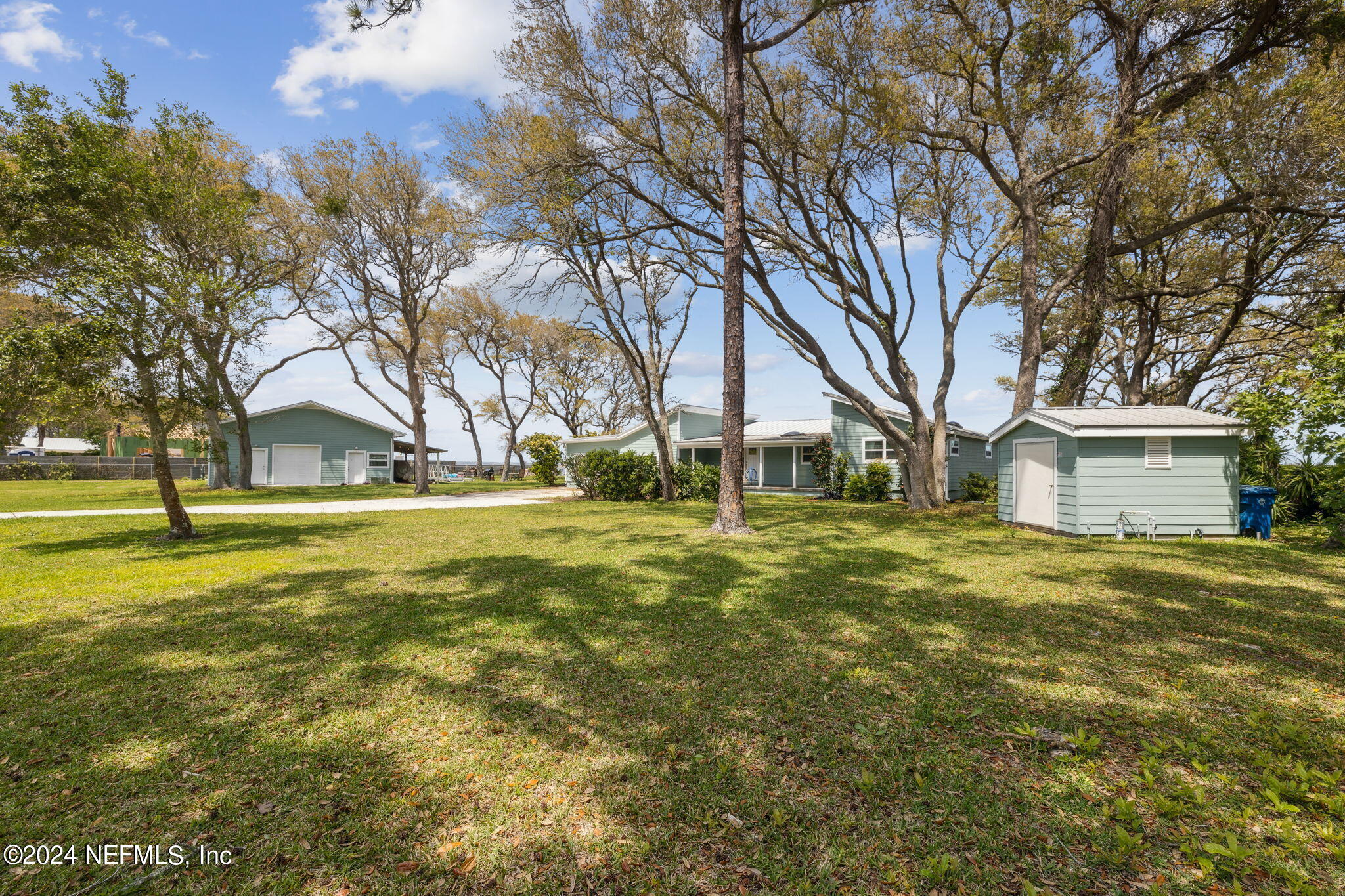 16045 Shellcracker Road Jacksonville, FL 32226 - Photo 38 of 40 a view of a house with a yard