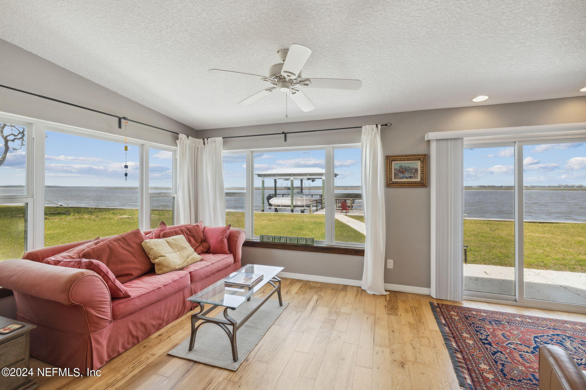 16045 Shellcracker Road Jacksonville, FL 32226 - Photo 4 of 40 a living room with furniture and a large window