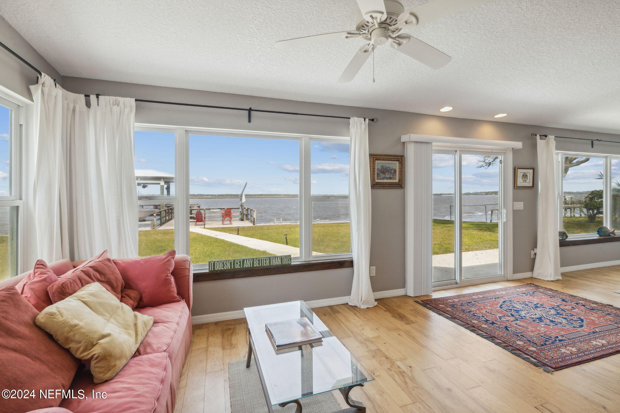 16045 Shellcracker Road Jacksonville, FL 32226 - Photo 5 of 40 a living room with furniture and a large window