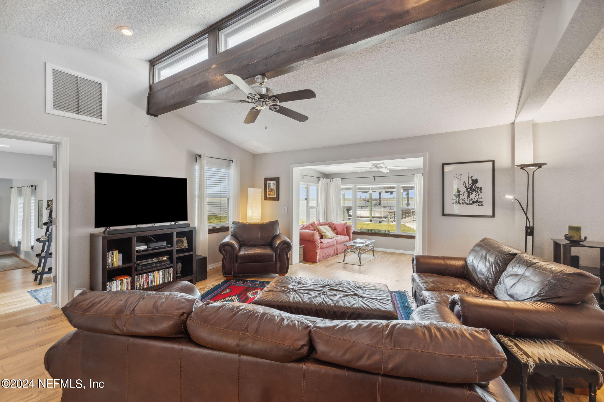 16045 Shellcracker Road Jacksonville, FL 32226 - Photo 7 of 40 a living room with furniture and a flat screen tv