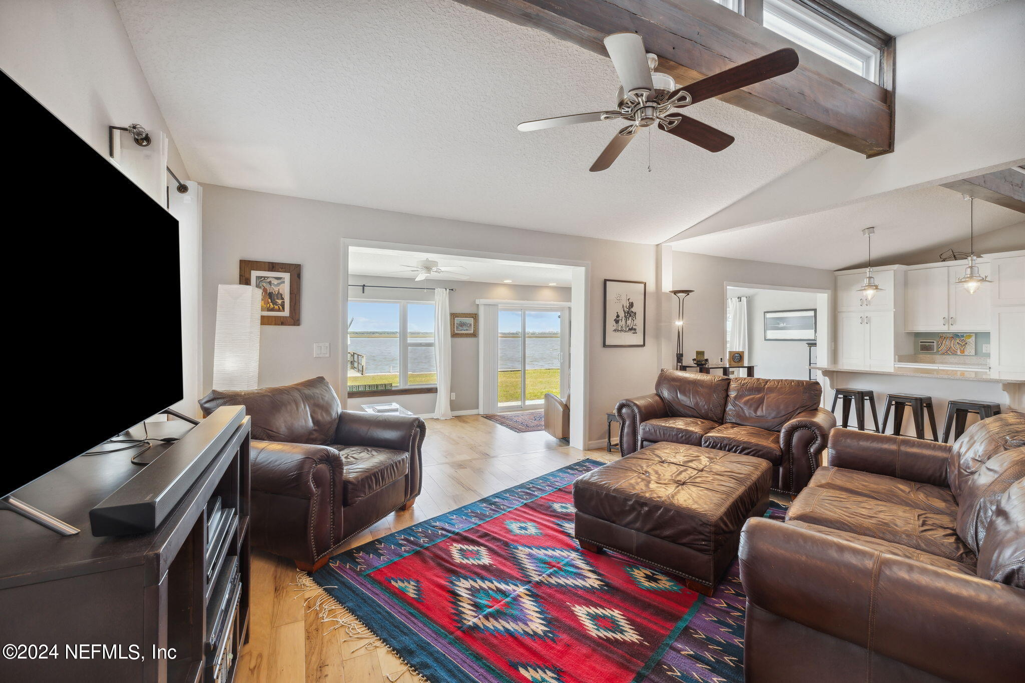 16045 Shellcracker Road Jacksonville, FL 32226 - Photo 9 of 40 a living room with furniture and a flat screen tv