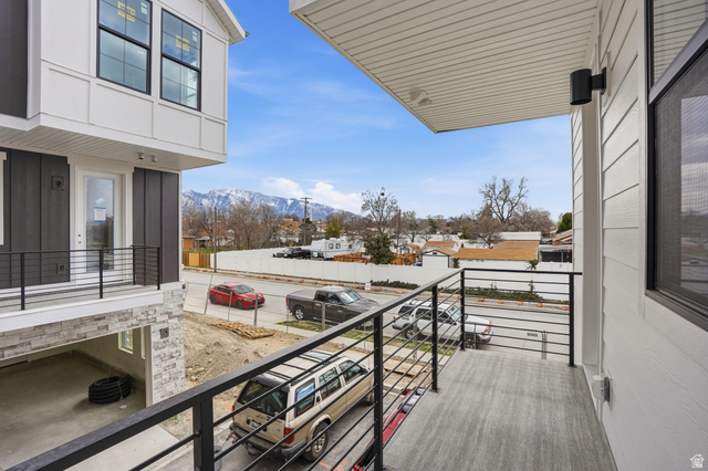 7338 South Seven Tree Lane, Unit 75 Midvale, UT 84047 - Photo 24 of 30 Balcony featuring a mountain view