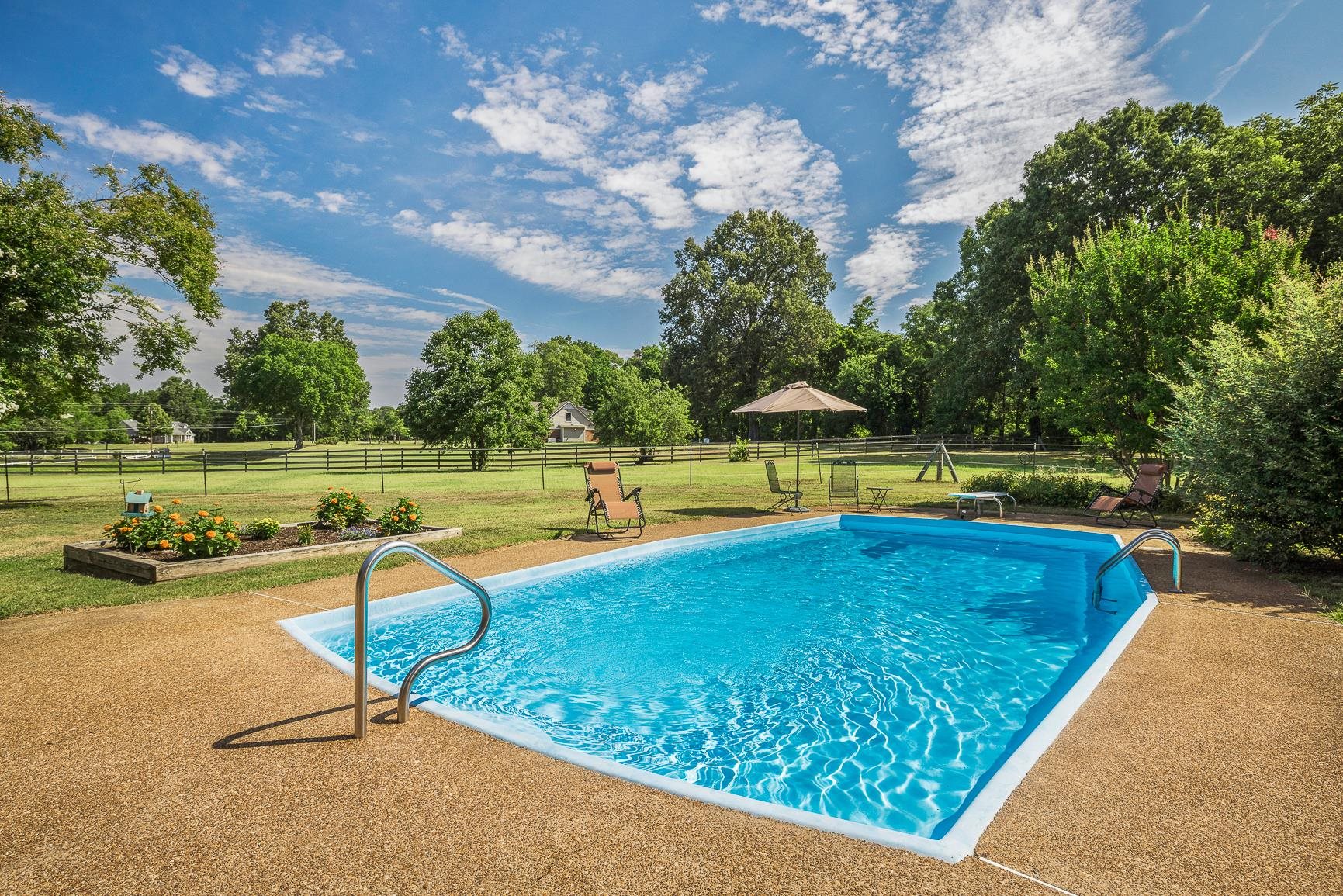 9820 Old Memphis Road Brighton, TN 38011 - Photo 22 of 25 an outdoor space with swimming pool and furniture