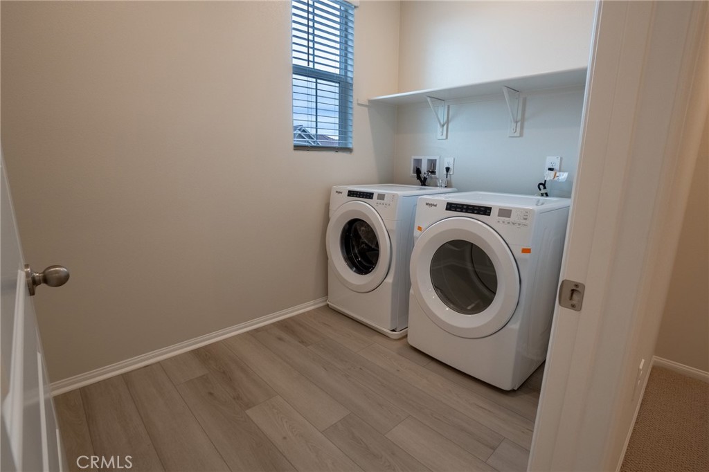 28586 Via Roble Temecula, CA 92591 - Photo 14 of 18 a utility room with dryer and washer