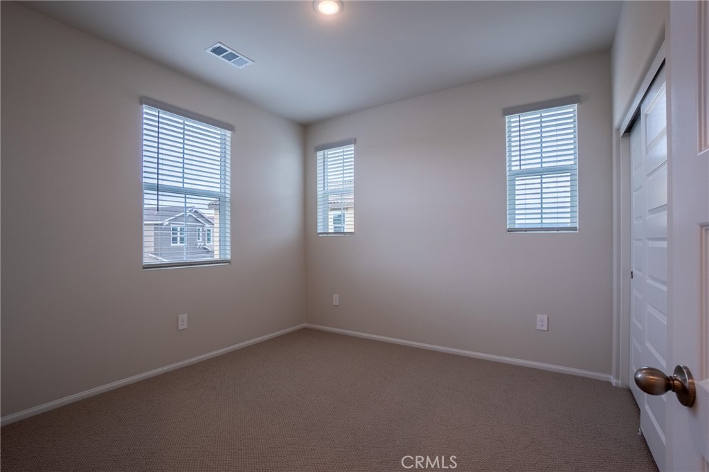 28586 Via Roble Temecula, CA 92591 - Photo 15 of 18 an empty room with windows
