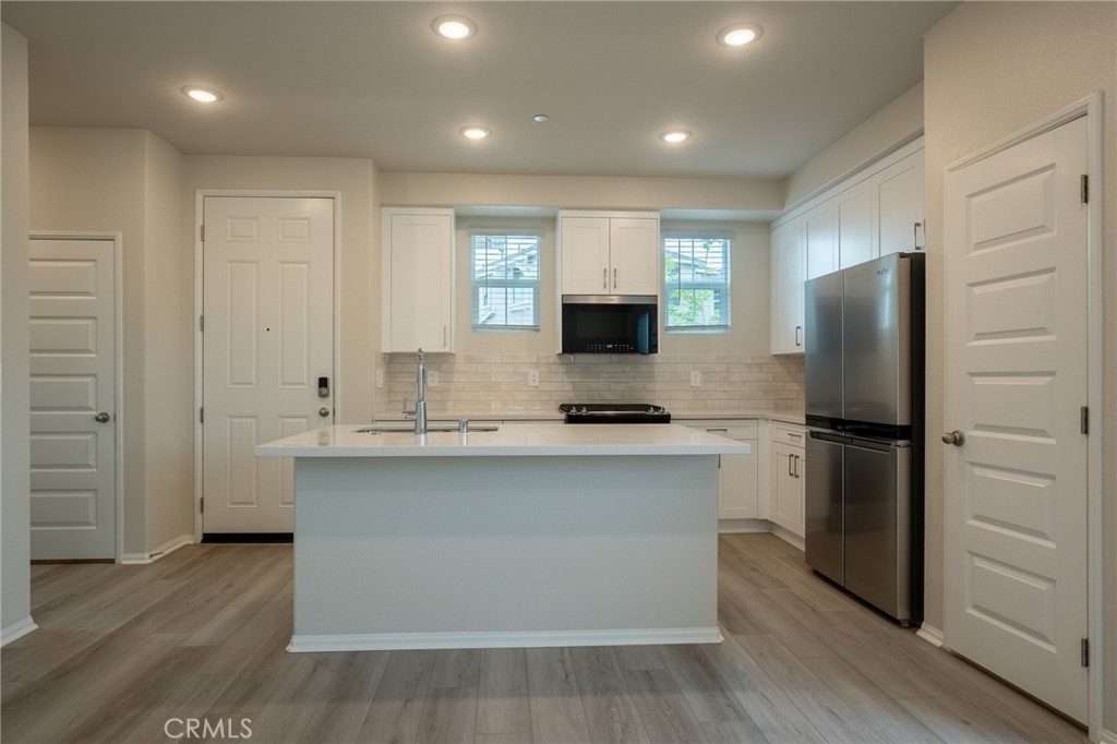 28586 Via Roble Temecula, CA 92591 - Photo 4 of 18 a kitchen with stainless steel appliances a refrigerator stove and sink