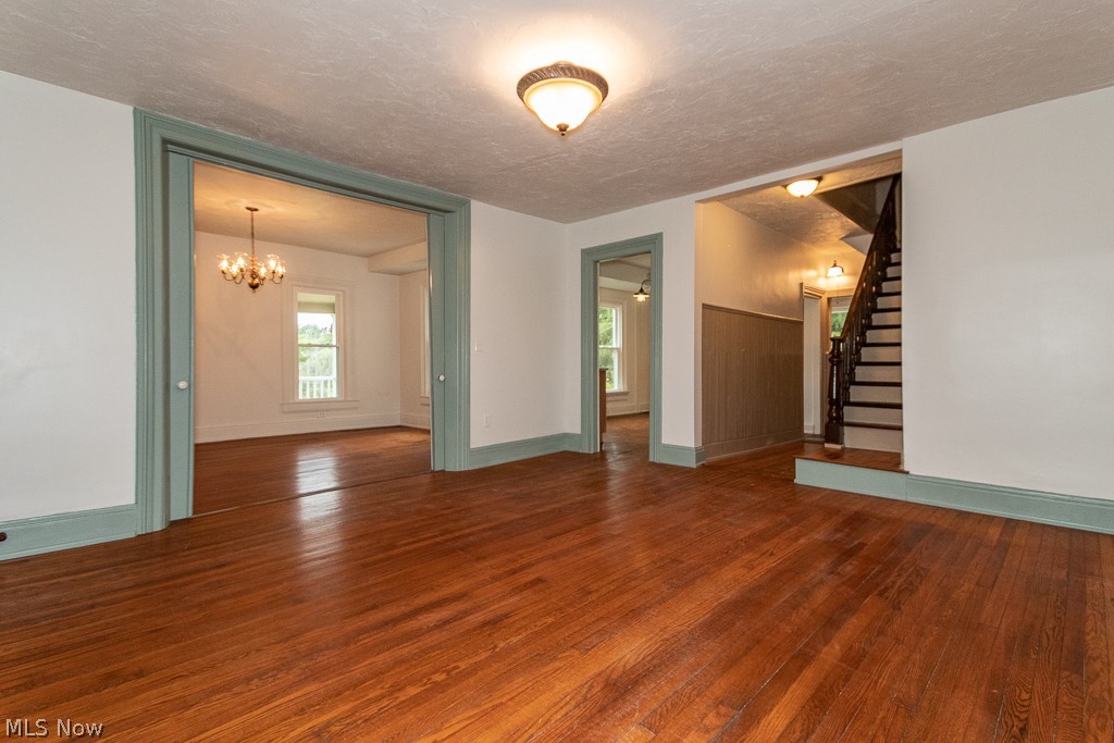 12285 Auburn Road Chardon, OH 44024 - Photo 17 of 35 Living room with access to the stairs, formal dining room, and kitchen