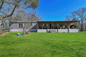 30263 Old Joseph Road Hockley, TX 77447 - Photo 3 of 10 a view of a house with backyard and a tree