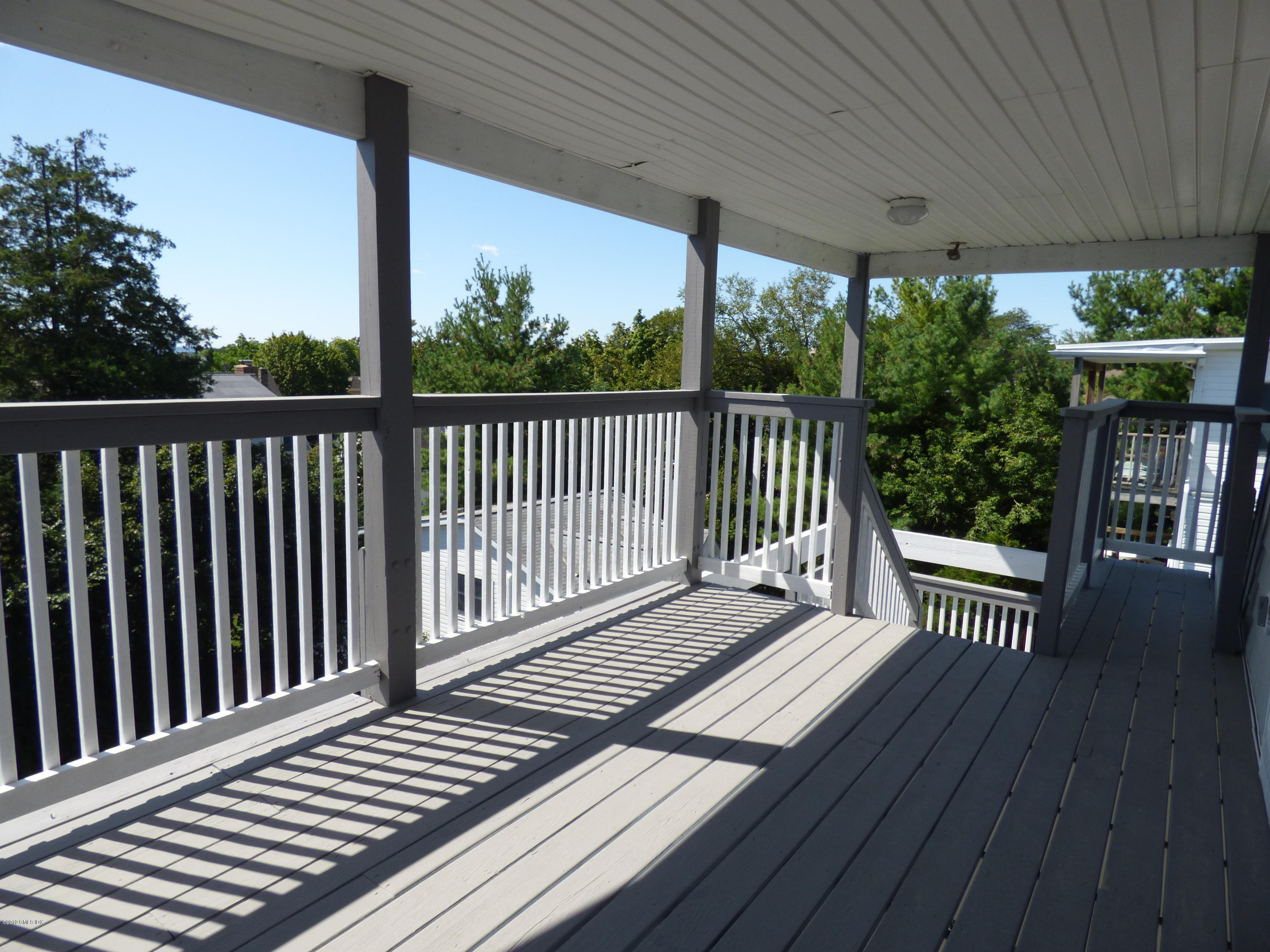 16 Lexington Avenue, Unit UPSTAIRS Greenwich, CT 06830 - Photo 11 of 12 a view of a wooden deck