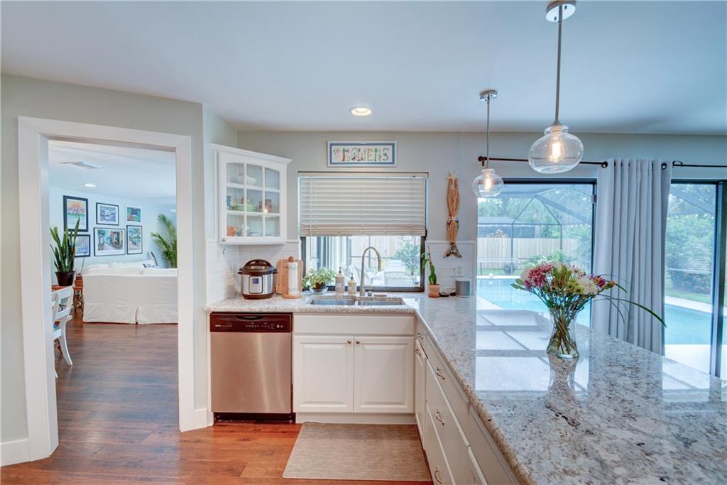 1139 Northwest Fork Road Stuart, FL 34994 - Photo 15 of 43 a kitchen with counter top space and wooden floor