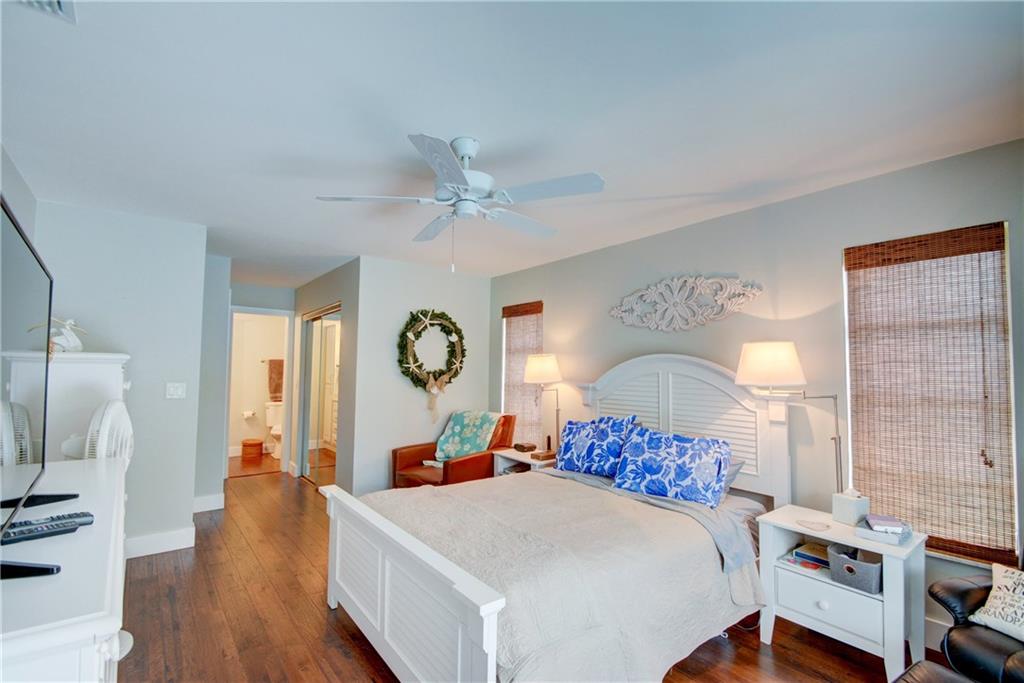 1139 Northwest Fork Road Stuart, FL 34994 - Photo 21 of 43 a bed room with a bed mirror and a window