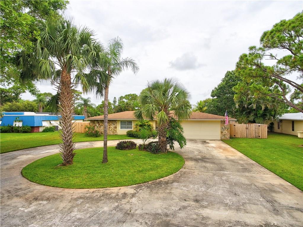 1139 Northwest Fork Road Stuart, FL 34994 - Photo 3 of 43 a view of a house with a backyard porch and entertaining space