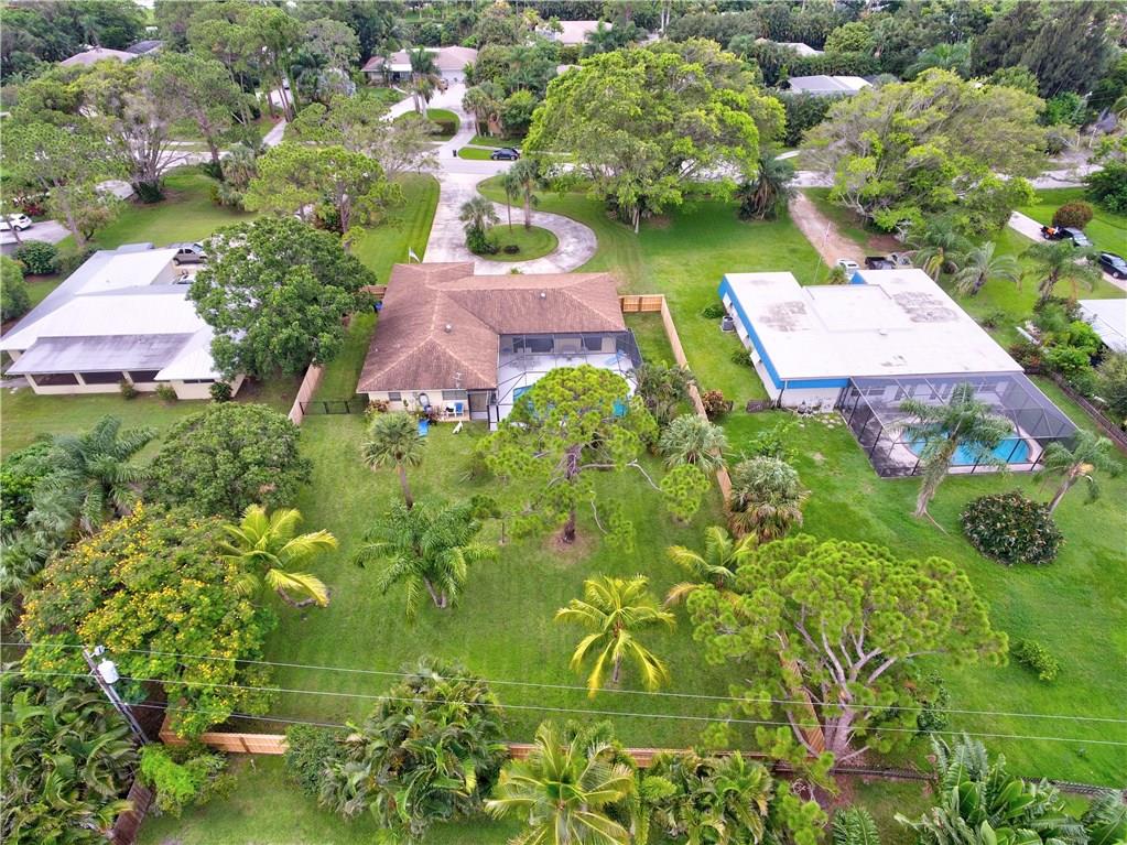 1139 Northwest Fork Road Stuart, FL 34994 - Photo 39 of 43 an aerial view of residential house with outdoor space and trees all around